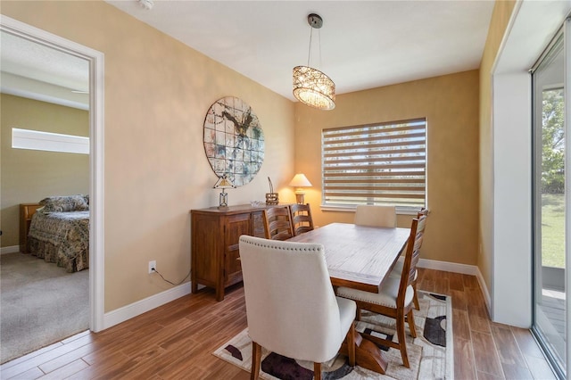 dining space featuring wood-type flooring