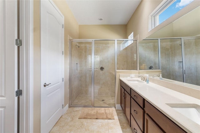 bathroom with vanity, tile patterned flooring, and a shower with door