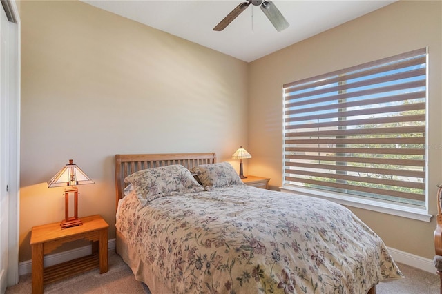 bedroom with light carpet and ceiling fan