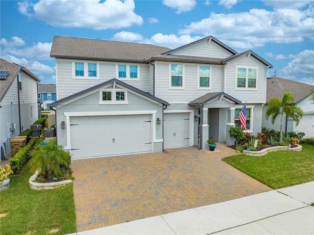 view of front of home with a garage and a front yard