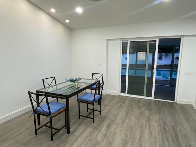 dining area featuring baseboards and wood finished floors