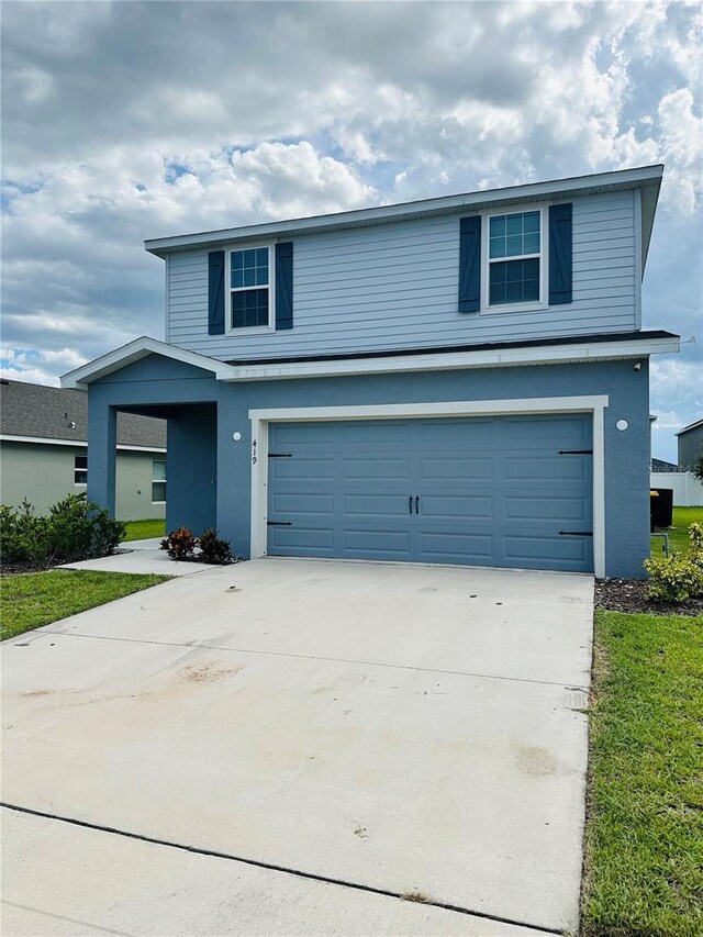 view of property featuring a garage