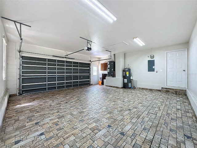 garage featuring a garage door opener, electric water heater, heating unit, and electric panel