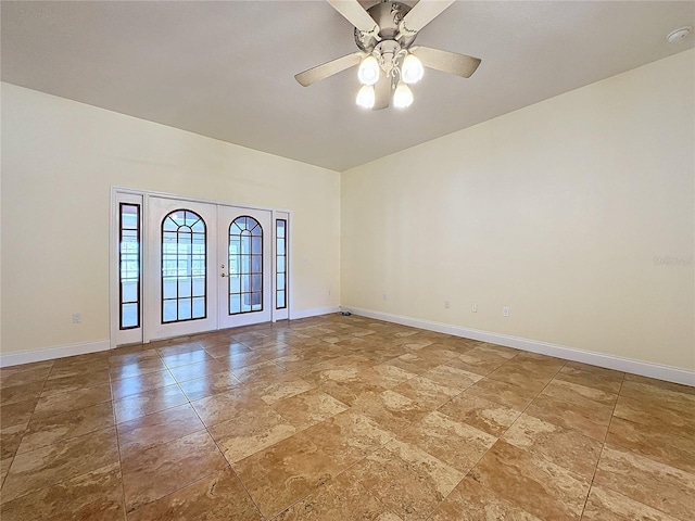 spare room with french doors and ceiling fan