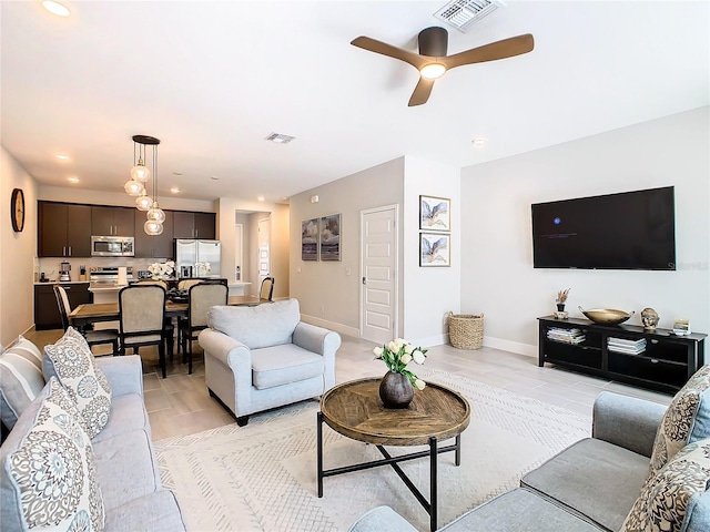 living room with ceiling fan