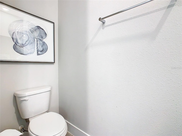 bathroom featuring toilet