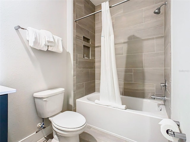 full bathroom featuring toilet, shower / bathtub combination with curtain, and vanity