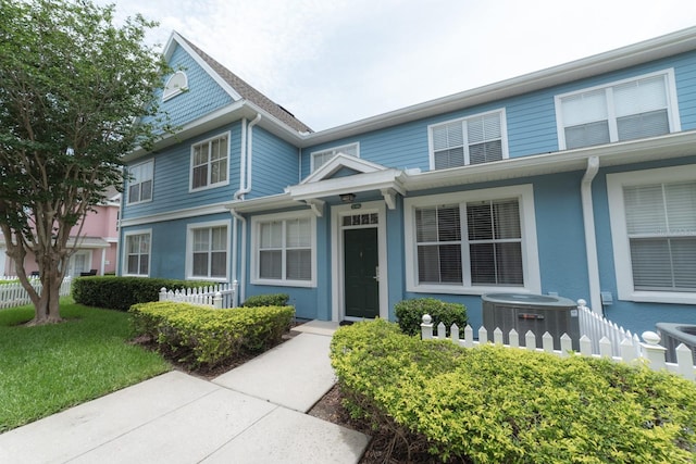 view of front of property with central AC unit