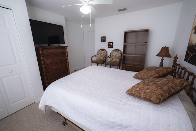 carpeted bedroom with a closet and ceiling fan