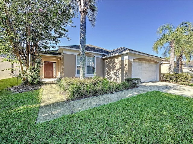 view of front of property featuring a front lawn and a garage