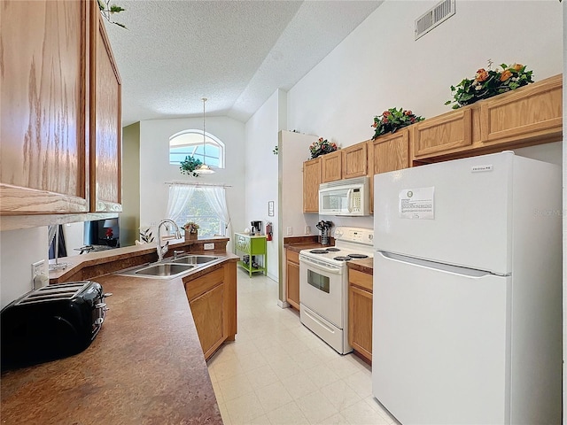 kitchen featuring decorative light fixtures, sink, white appliances, a textured ceiling, and high vaulted ceiling