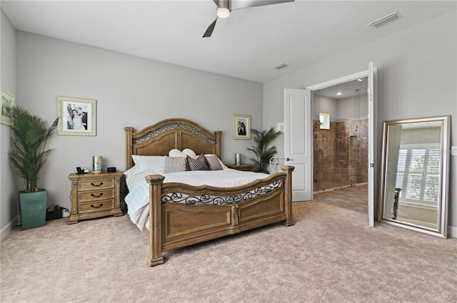 bedroom with carpet flooring, ensuite bathroom, and ceiling fan