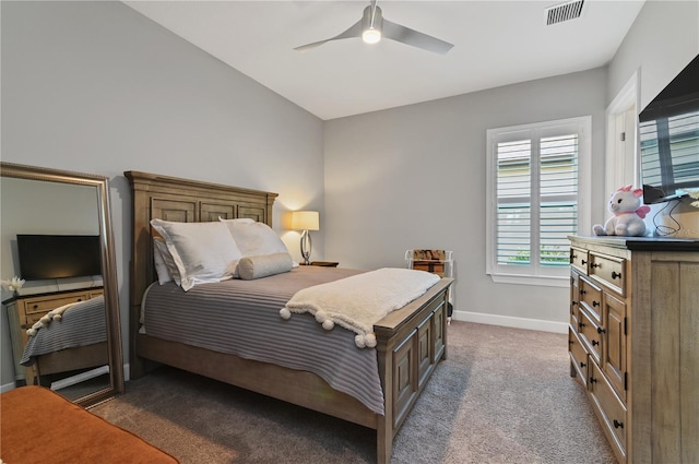 bedroom with dark colored carpet and ceiling fan