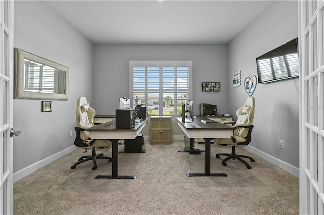 office area featuring light carpet and french doors