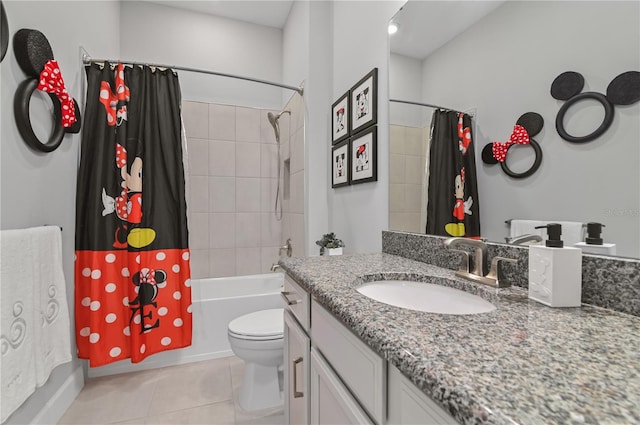 full bathroom with tile patterned floors, vanity, shower / tub combo, and toilet