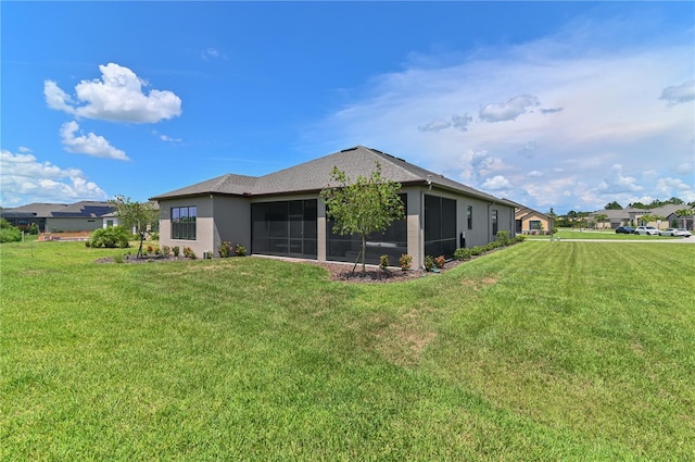 rear view of property with a yard