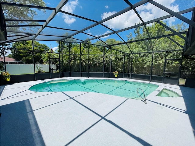 view of pool featuring a patio and glass enclosure