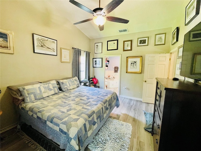 bedroom featuring ceiling fan, light wood-type flooring, and vaulted ceiling