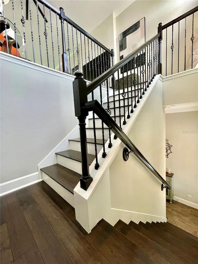 stairway featuring hardwood / wood-style flooring