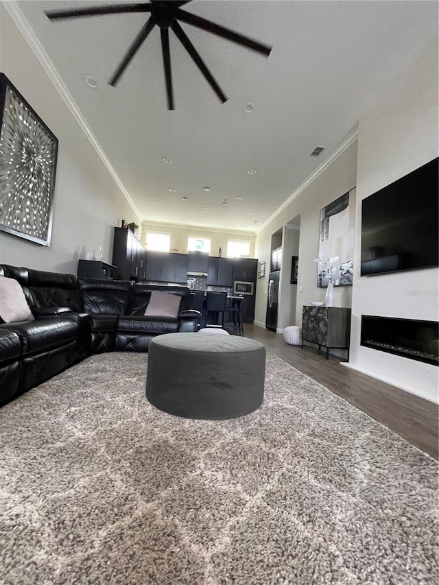 living room featuring crown molding and dark hardwood / wood-style floors