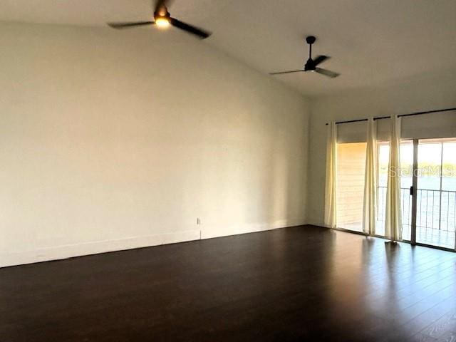 empty room with ceiling fan and lofted ceiling