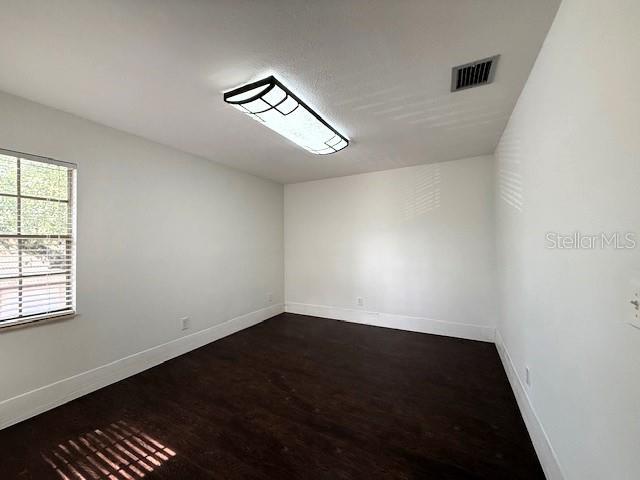 spare room featuring hardwood / wood-style floors