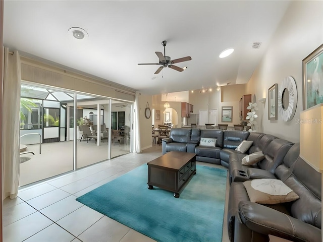 living room with tile patterned flooring and ceiling fan