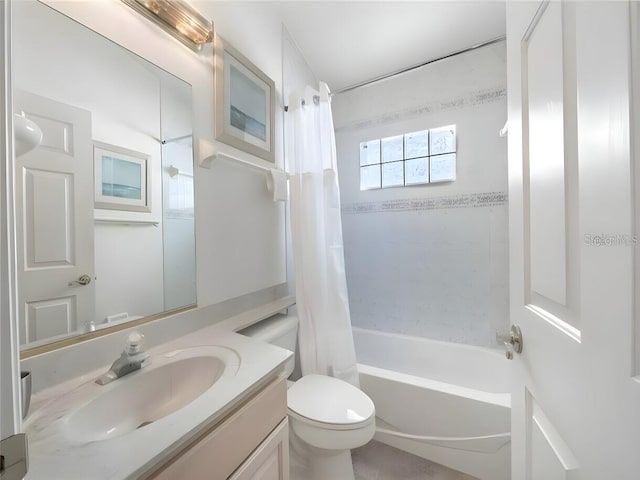 full bathroom with shower / bath combo with shower curtain, toilet, and vanity