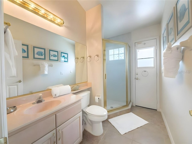 bathroom featuring vanity, walk in shower, tile patterned flooring, and toilet