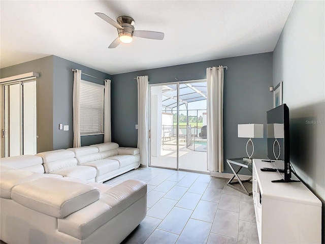 tiled living room featuring ceiling fan