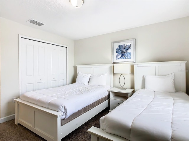 carpeted bedroom with a closet