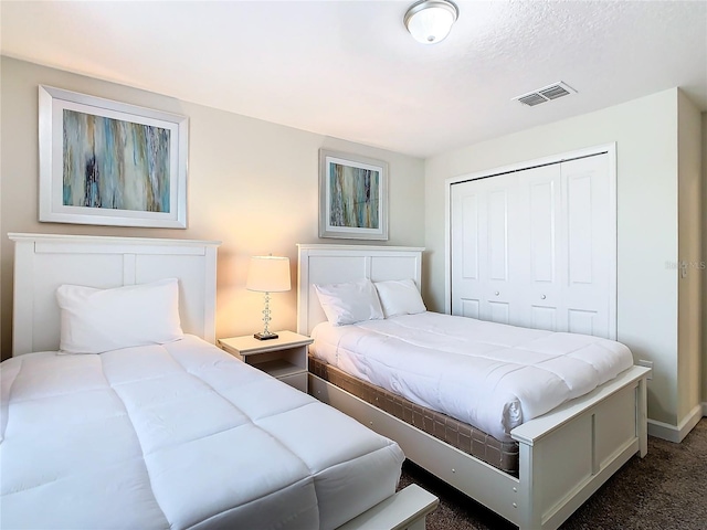 carpeted bedroom with a closet