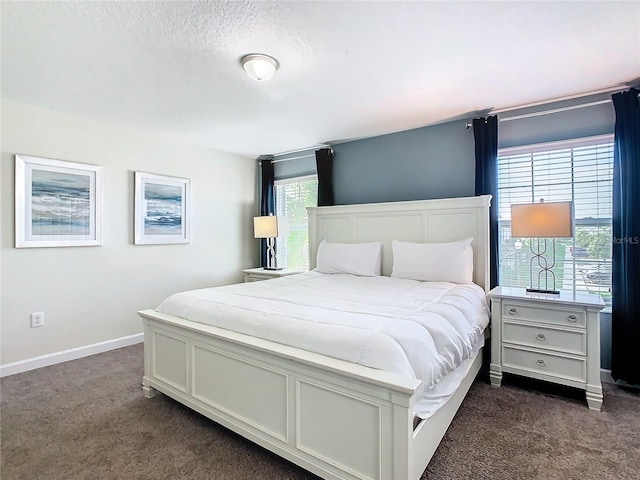 bedroom featuring dark colored carpet