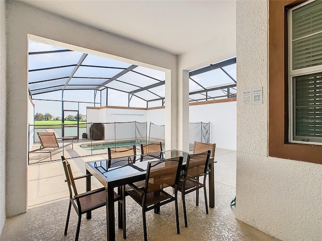 sunroom / solarium featuring lofted ceiling