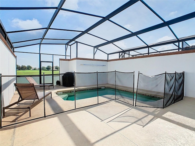 view of pool with a patio and a lanai