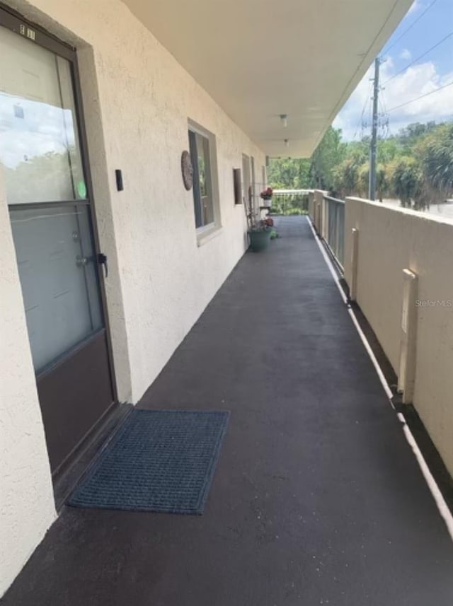 view of patio featuring a balcony