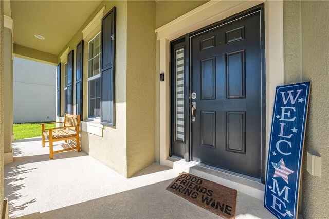 property entrance with covered porch