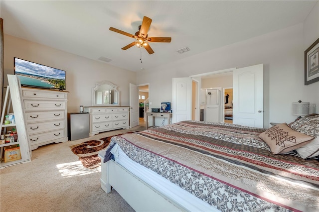 bedroom featuring light colored carpet and ceiling fan