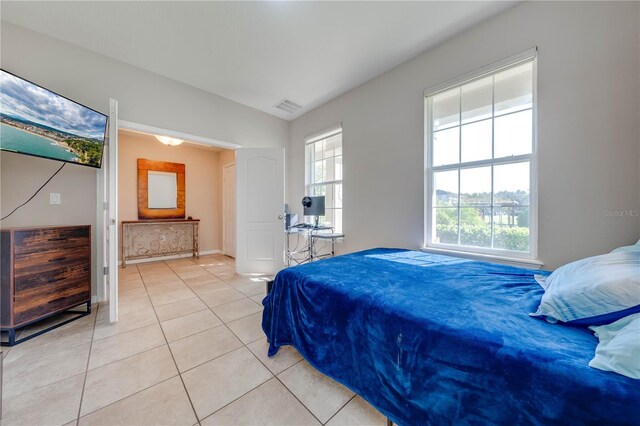 bedroom with light tile patterned floors