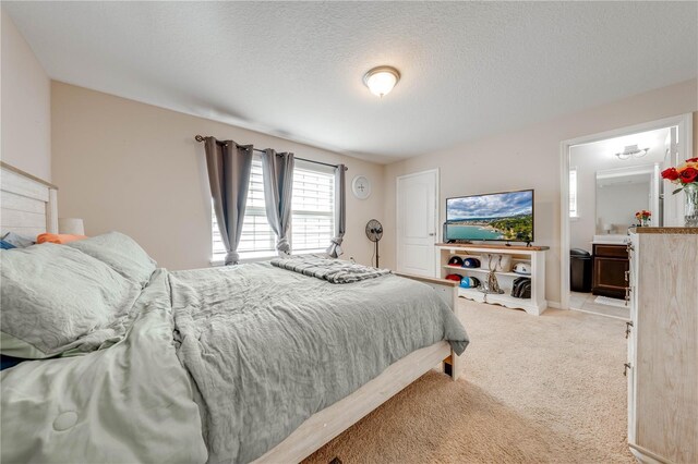 carpeted bedroom with a textured ceiling