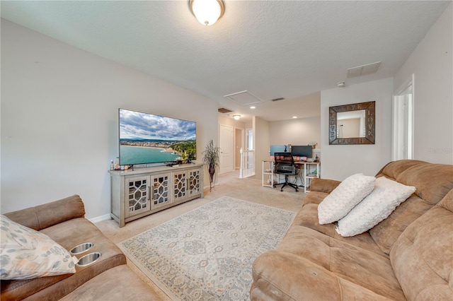 carpeted living room with a textured ceiling