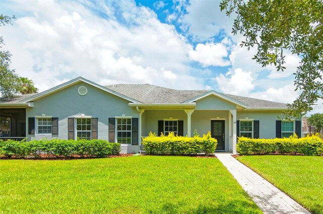 ranch-style house with a front lawn