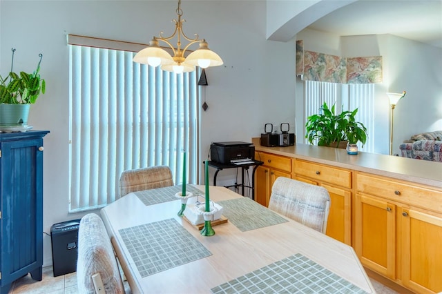 dining area with an inviting chandelier