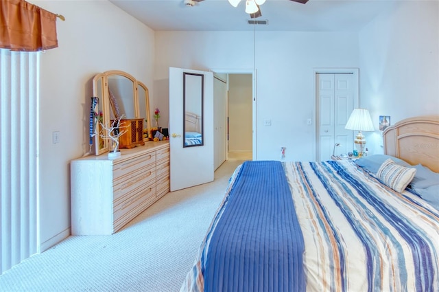 carpeted bedroom with a closet and ceiling fan