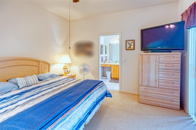 carpeted bedroom featuring ensuite bath