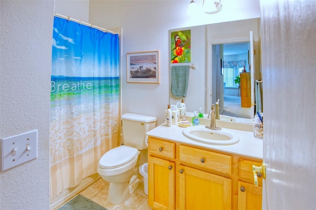 full bathroom with shower / tub combo with curtain, vanity, toilet, and tile patterned flooring