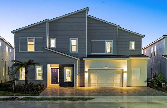 view of front of property with a garage