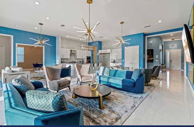 living room featuring a notable chandelier