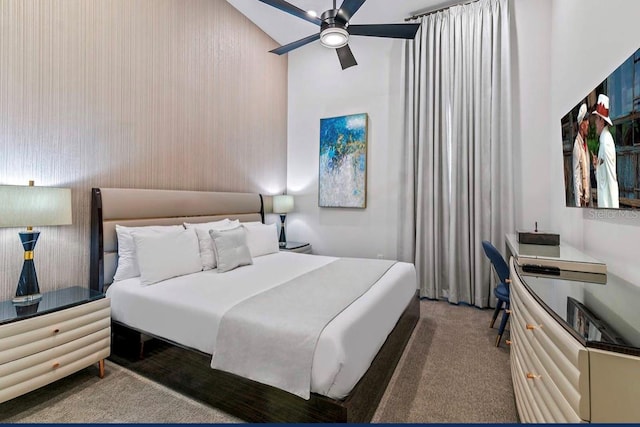 bedroom featuring ceiling fan, carpet floors, and lofted ceiling