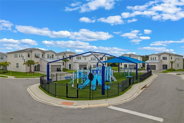 view of front of property featuring a playground and a front lawn